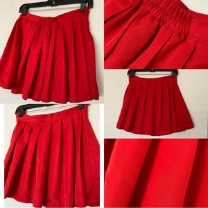 Red pleated skater skirt